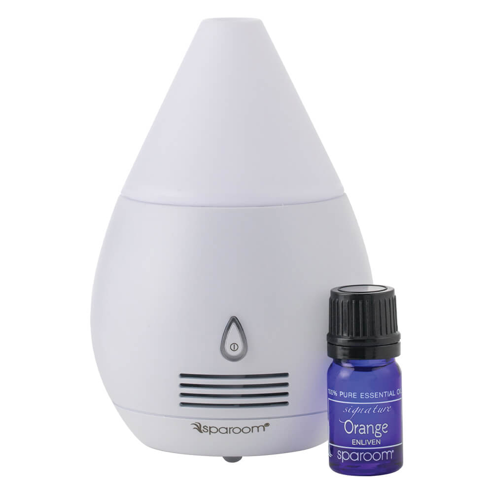 Mini Scentifier White Essential Oil Diffuser With An Oil Standing Next To It On A White Background